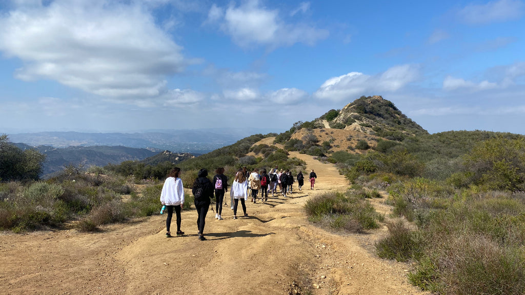 Hiking Los Angeles trails of Topanga State park. Chapman University Gamm Phi Beta hikes out to the outlook to pick up trash with West Friends guides Kyle and Andy.